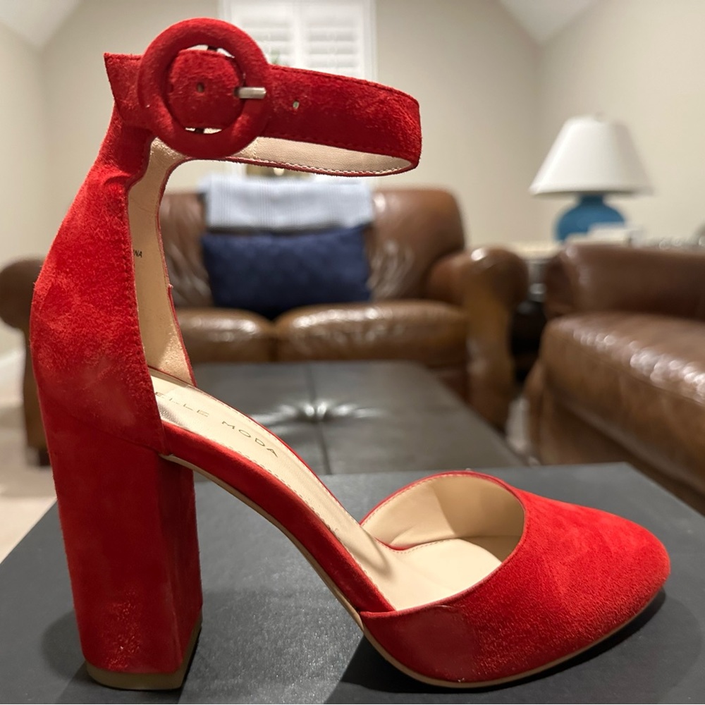 Beautiful red round toe heels.